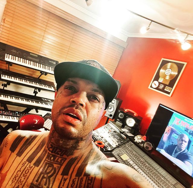 shirtless selfie of dj paul  in his studio wearing a cap